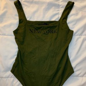 Olive green bodysuit. Clips at bottom